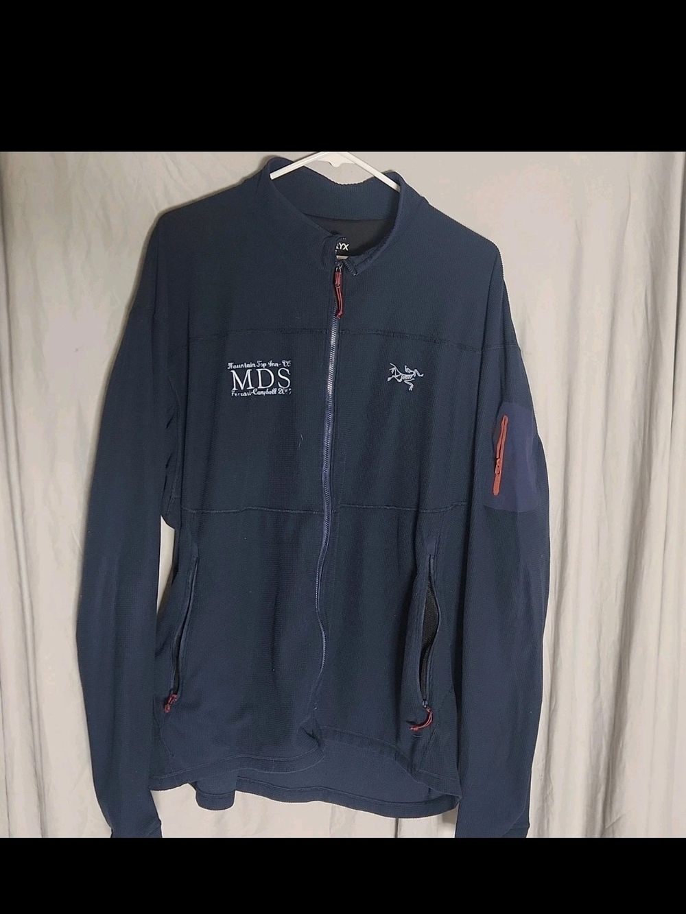 Authentic Arc'teryx men's full-zip fleece jacket in navy blue, featuring Polarte